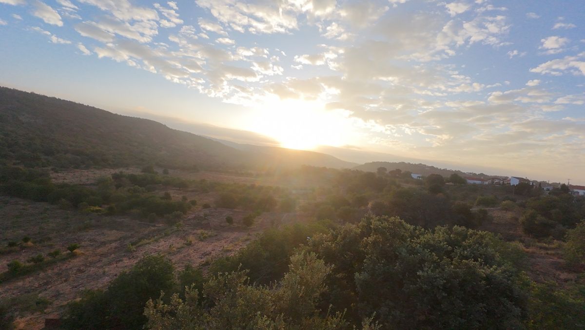 Low sun over the scrub and rolling hills of the Algarve interior at the end of day 2