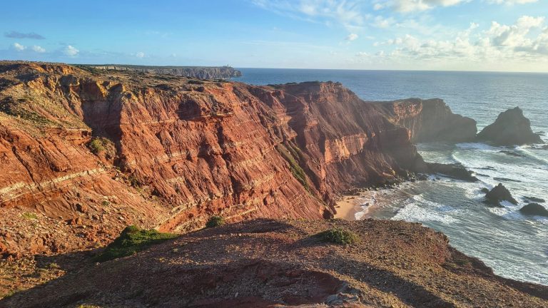 Red cliffs and sea stacks on the Algarve coast