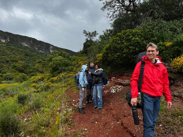 Expedition members on a trail in the green Algarve hills