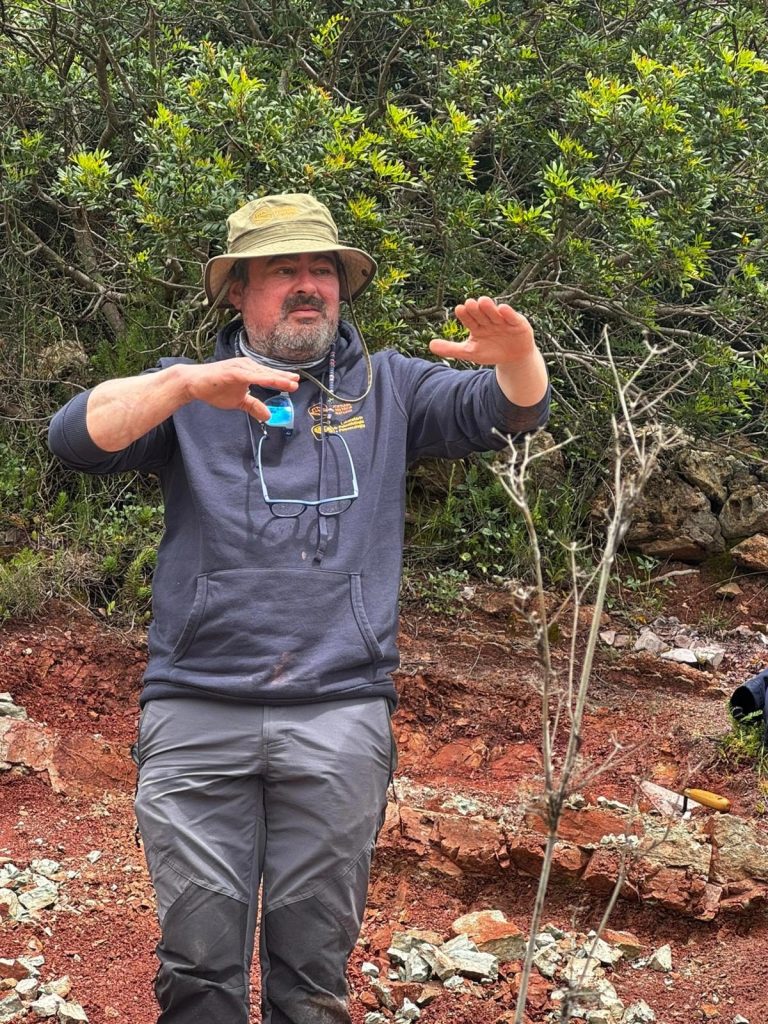 Expedition member explaining the site in the field