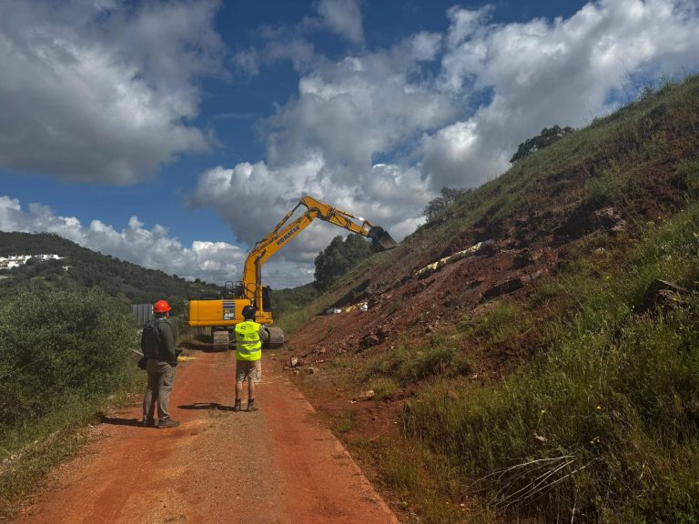 Excavator working at the end of a valley track