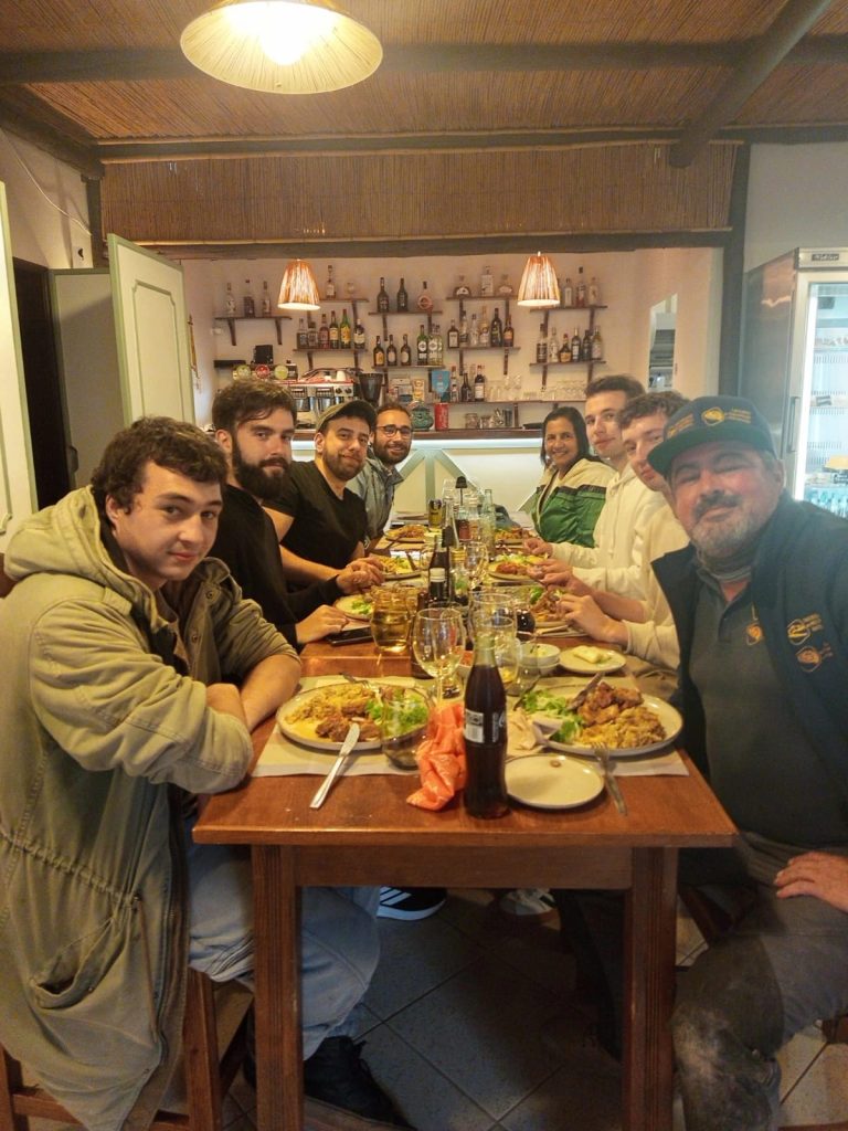 Field team at dinner together after a day at the dig