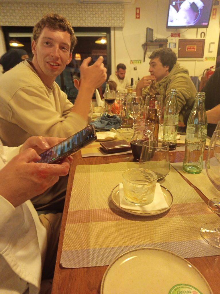 Team members relaxing at dinner