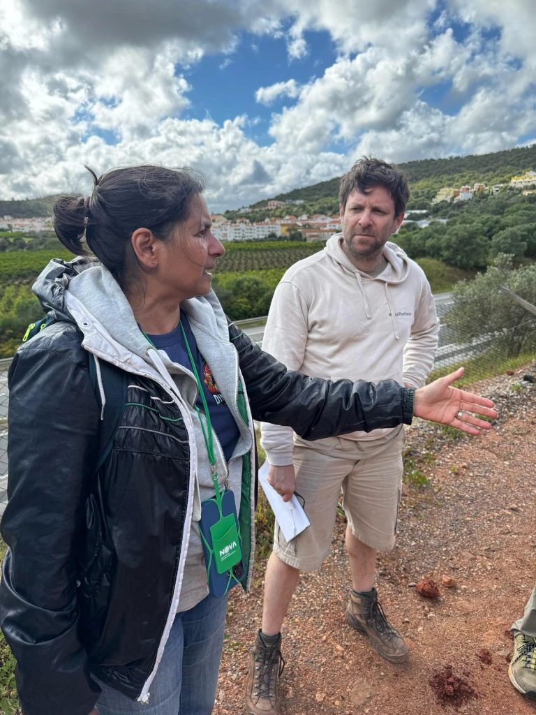 2 team members discussing the site on a hillside