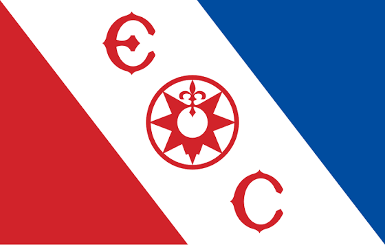 The flag of The Explorers Club: a white diagonal band between a red triangle and a blue triangle, with the letters E and C and a compass rose in red.